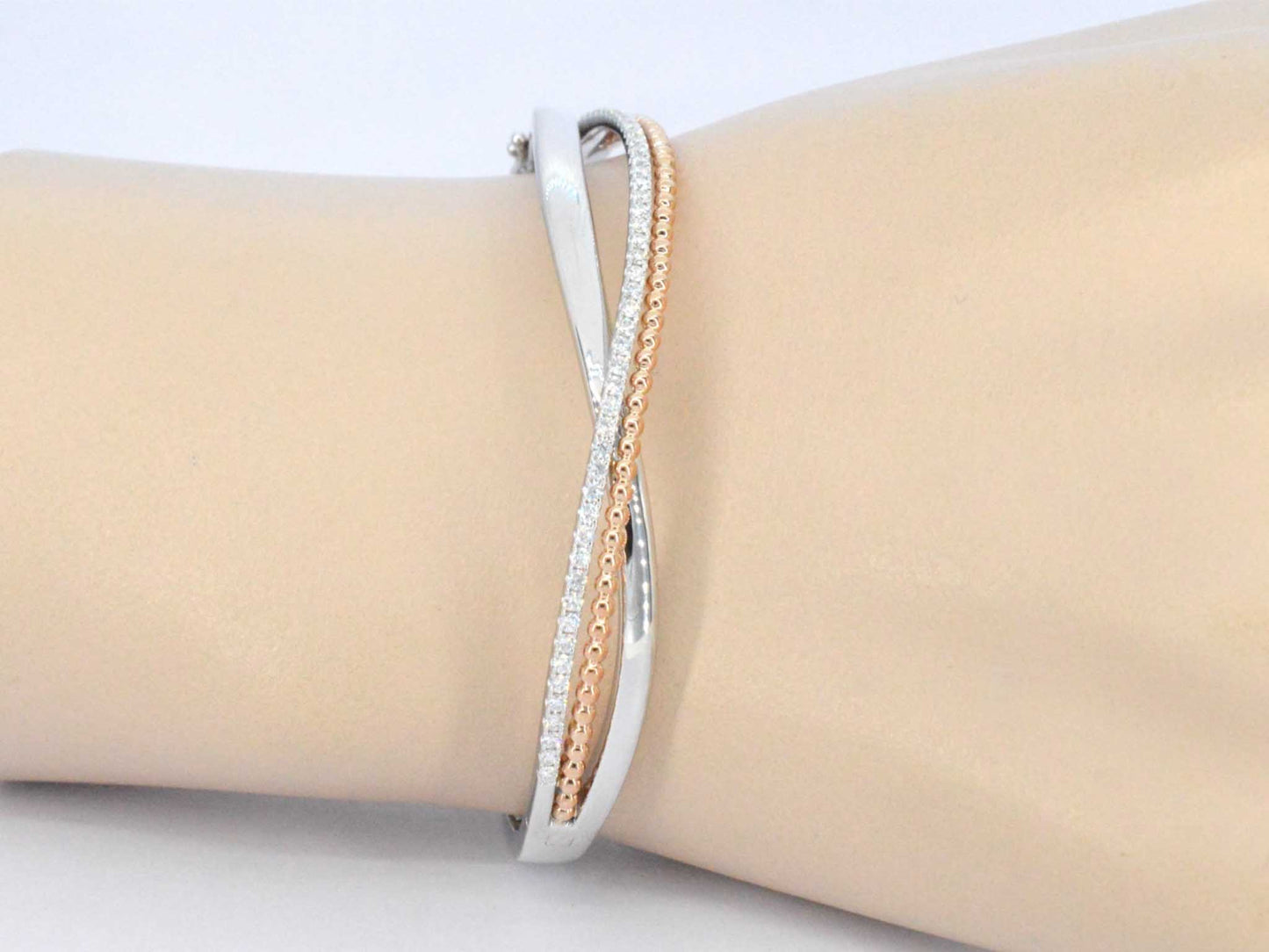 Gouden armband uit wit en rosegoud met diamanten