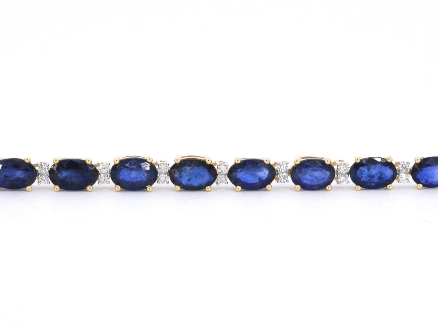 Gouden tennisarmband met diamanten en saffier