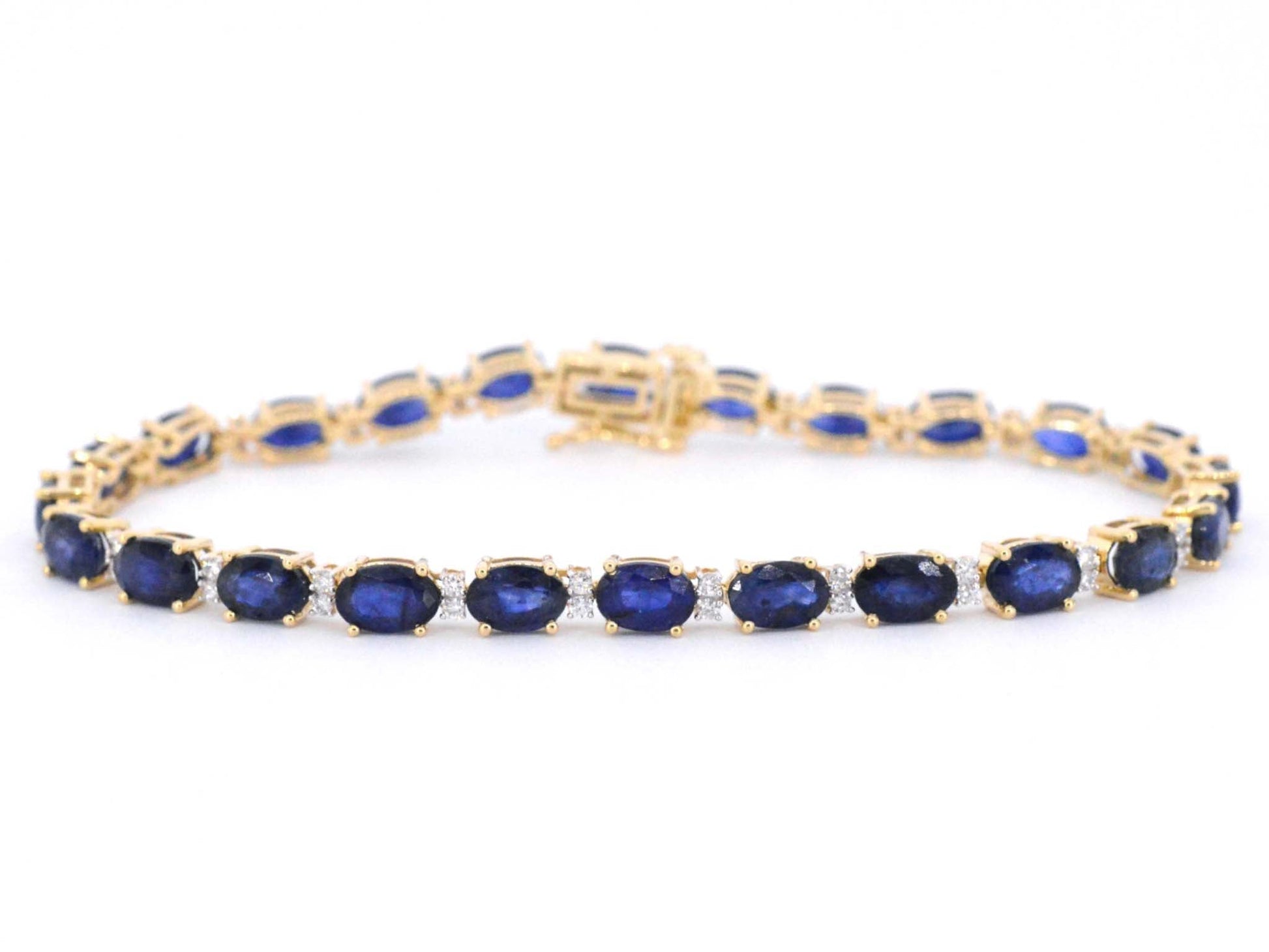 Gouden tennisarmband met diamanten en saffier