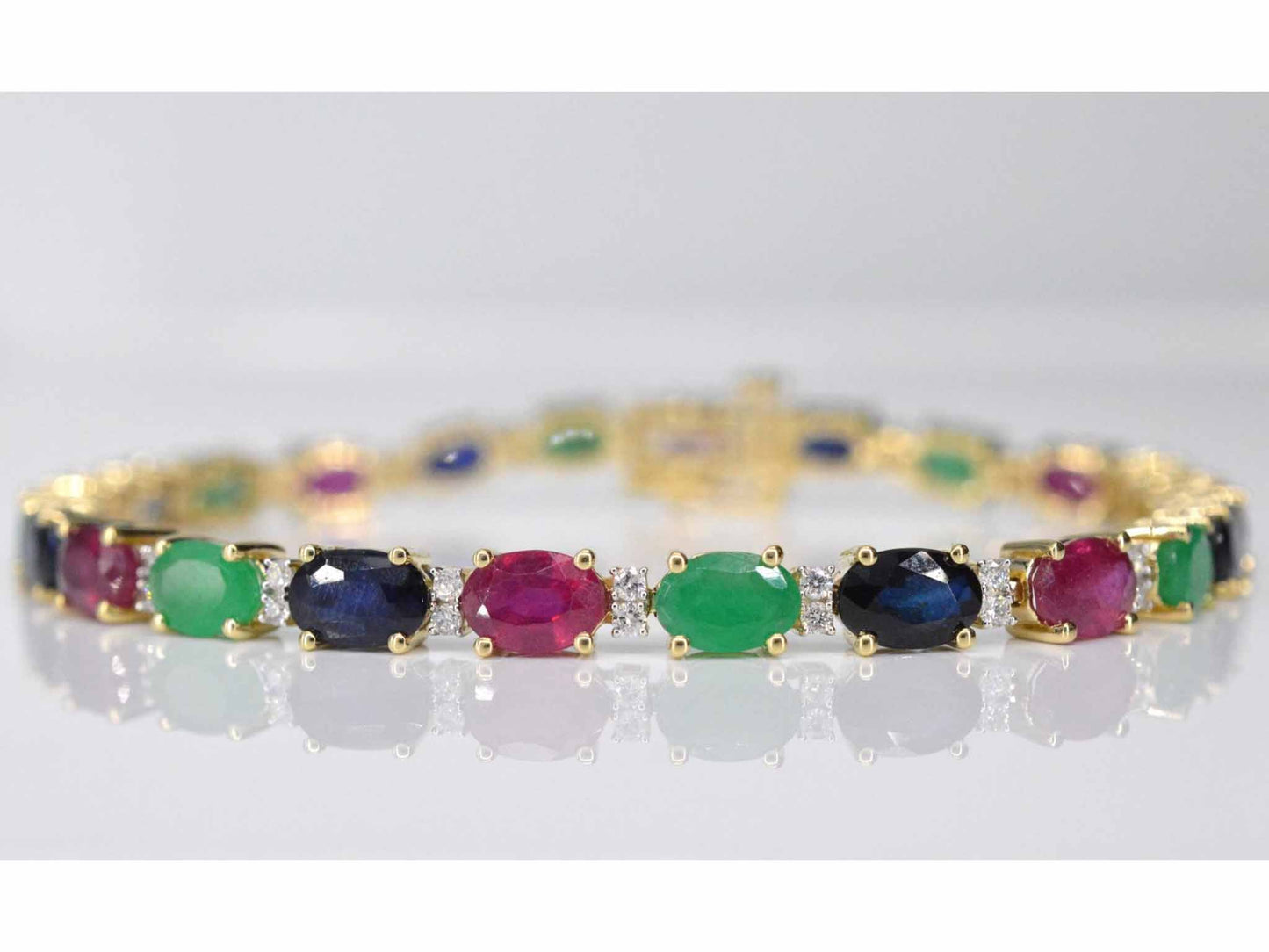 Gouden tennisarmband met diamanten, saffier, robijn en smaragd