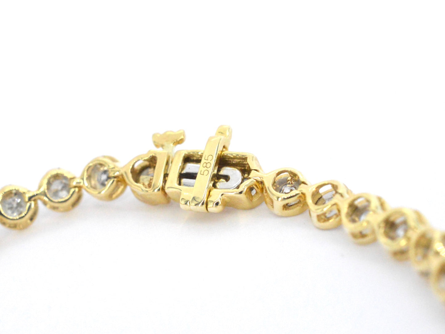 Gouden armband vol met diamanten gezet