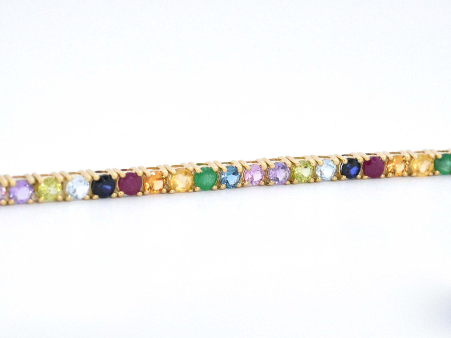 Geelgouden tennisarmband met multi colour edelstenen