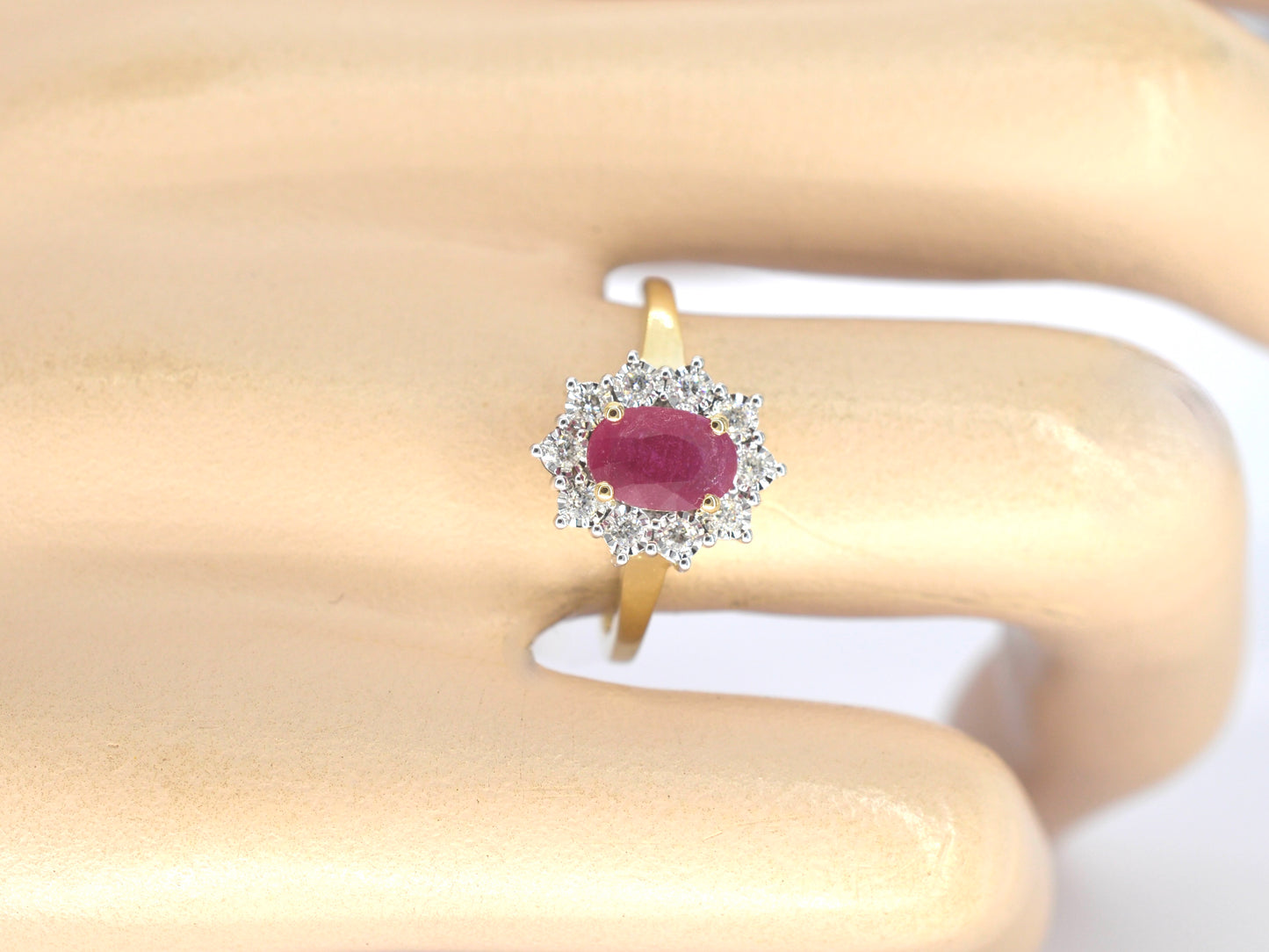Gold entourage ring with ruby and diamonds