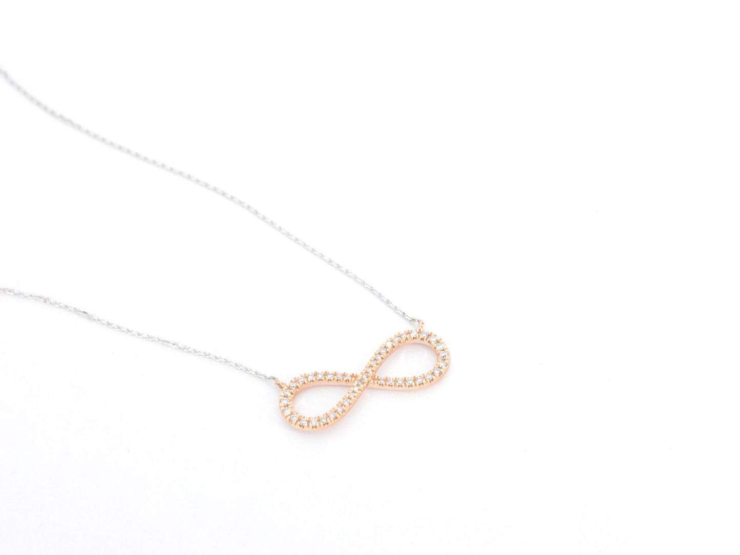 Witgouden collier met een rosegouden diamanten infinity hanger