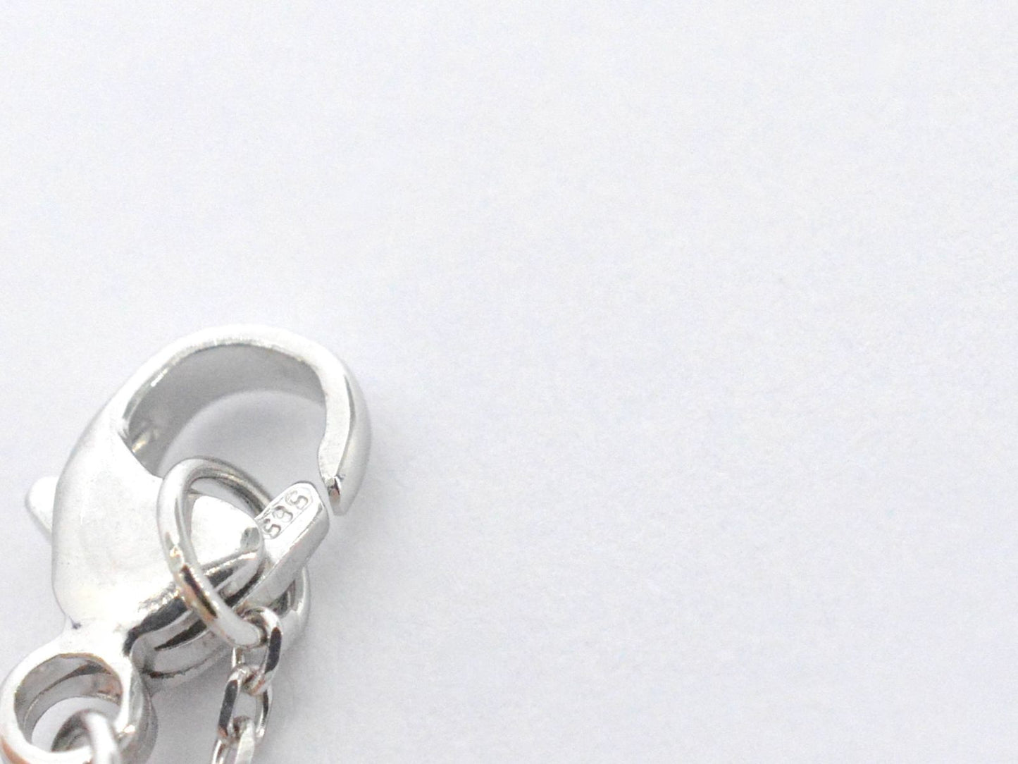 Witgouden collier met een rosegouden diamanten infinity hanger