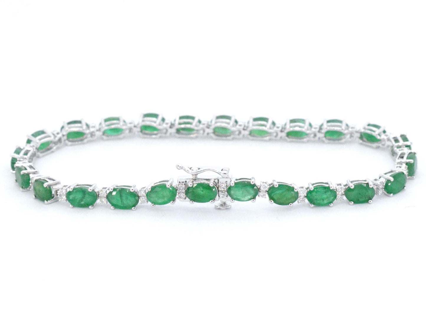 Witgouden tennisarmband met diamanten en smaragd