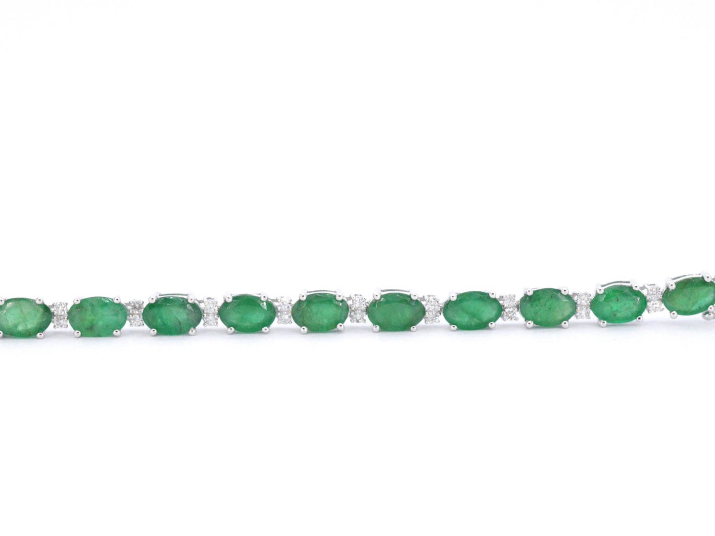 Witgouden tennisarmband met diamanten en smaragd