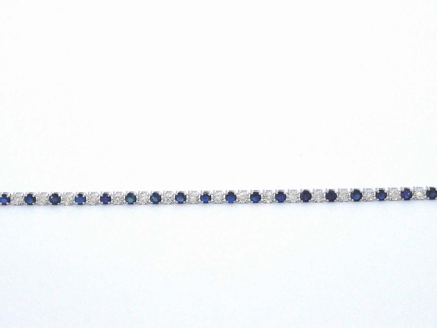 Witgouden tennis armband met diamanten en saffieren
