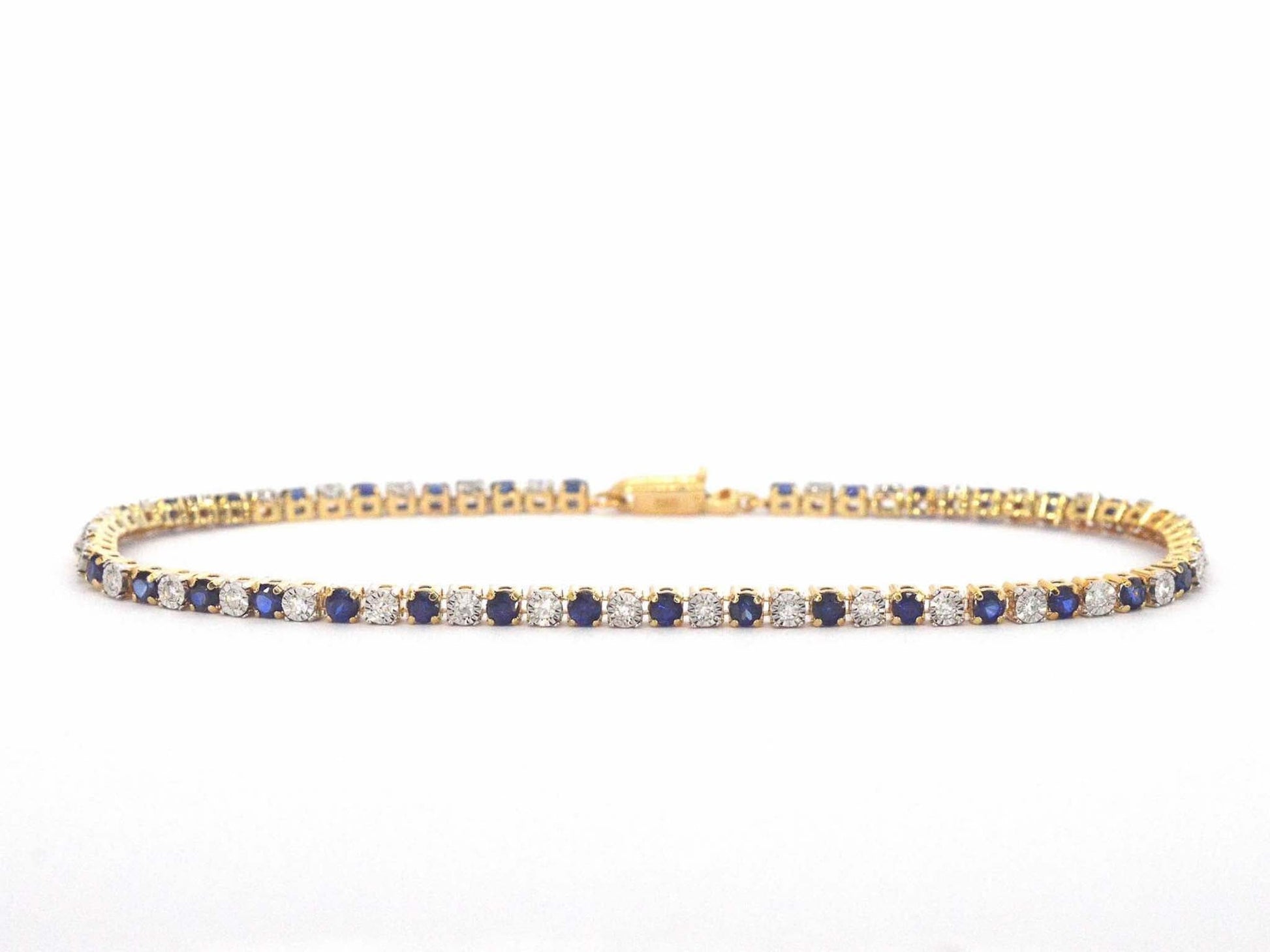 Gouden tennis armband met diamanten en saffieren