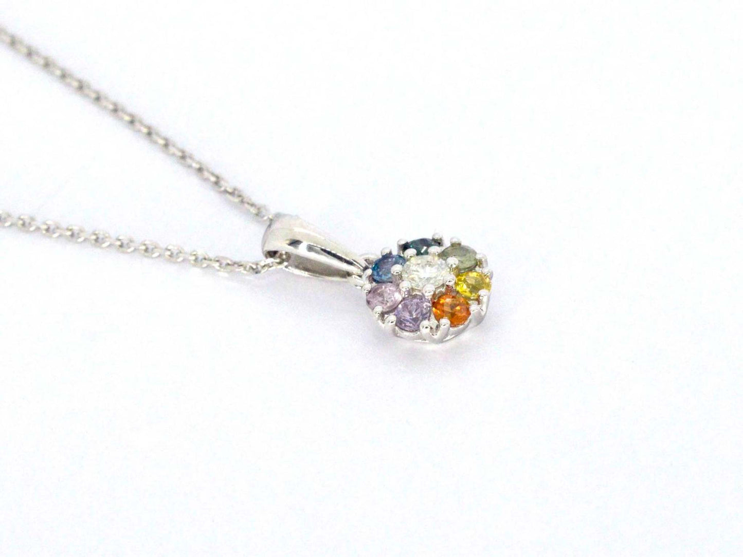 Witgouden hanger met diamanten en saffieren