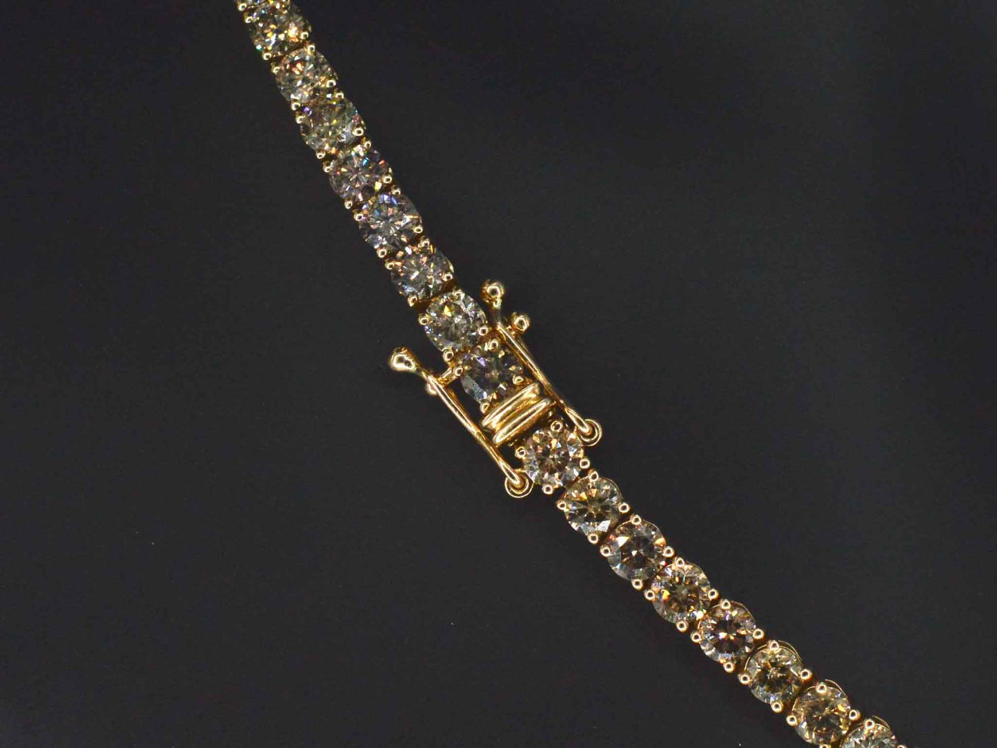 Geelgouden exclusieve tennis collier met champagne en cognac diamanten