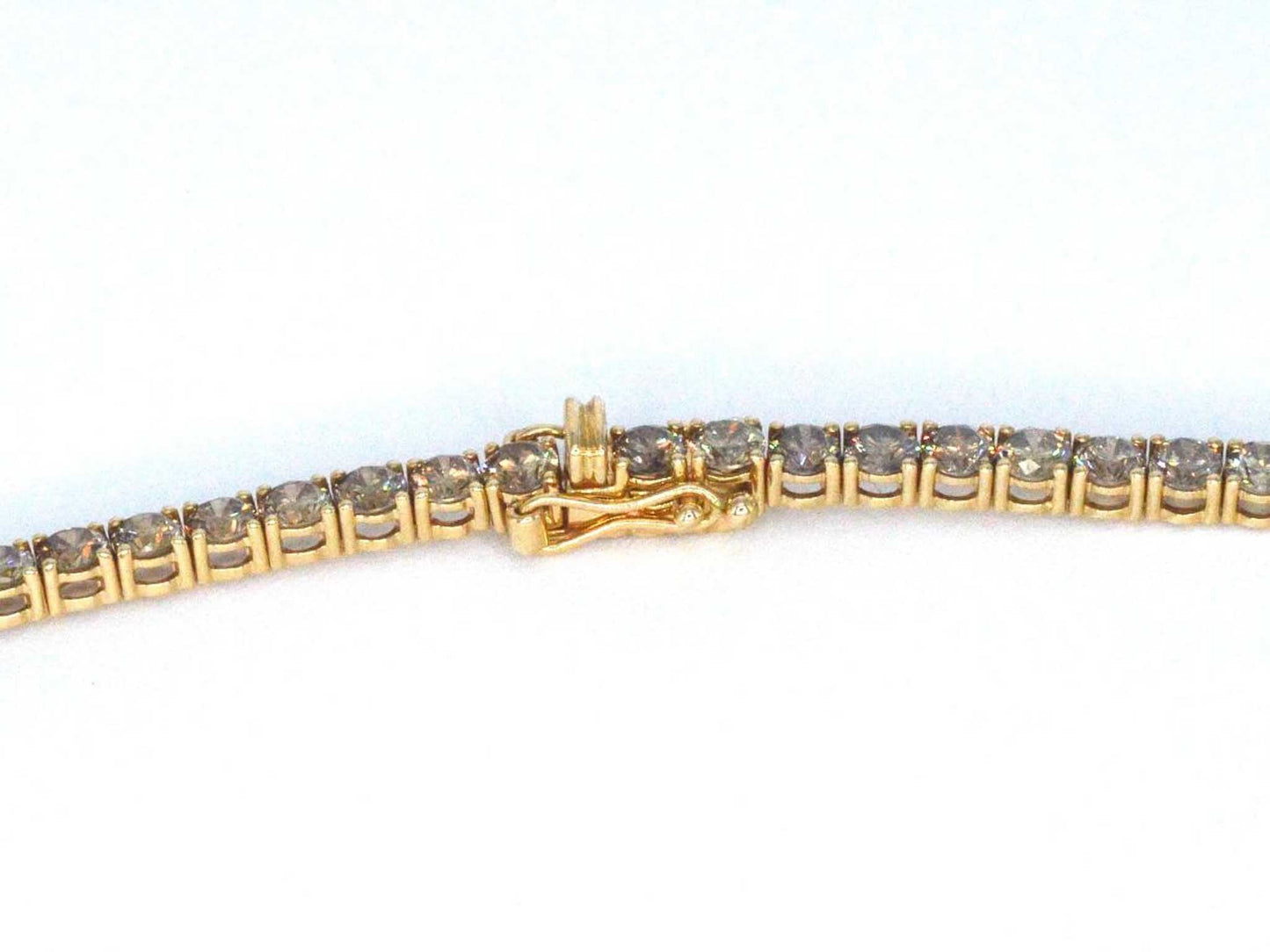 Geelgouden exclusieve tennis collier met champagne en cognac diamanten