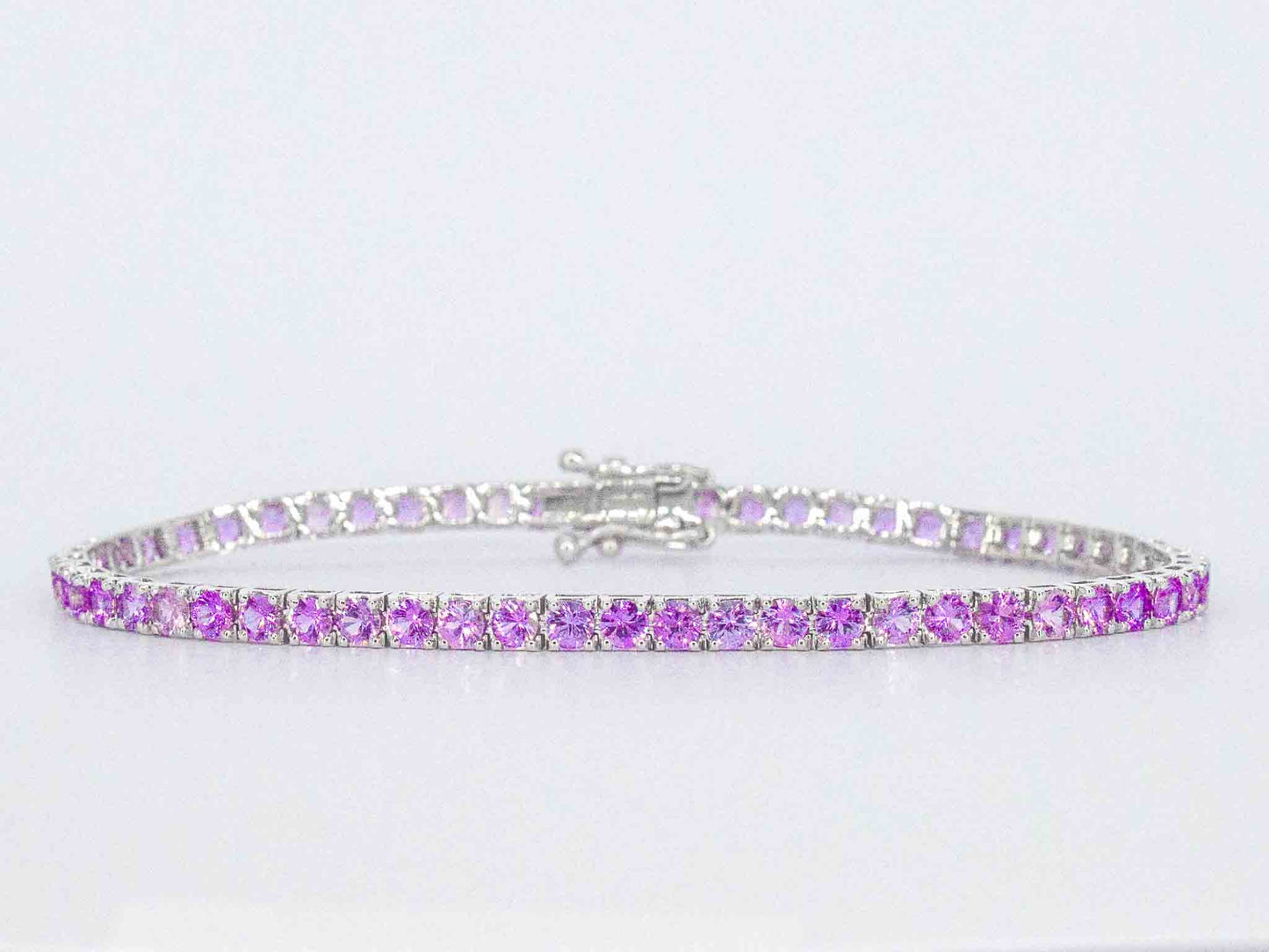 Gouden tennisarmband met 6.00 carat aan roze saffieren
