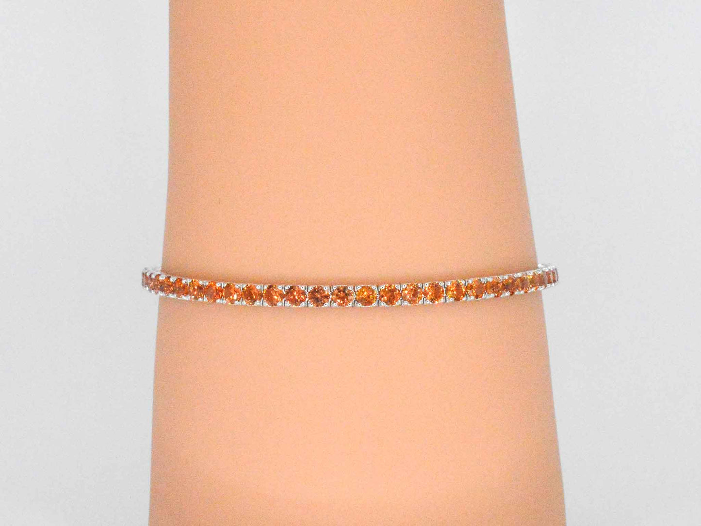 Gouden tennisarmband met 8.00 carat aan oranje saffieren