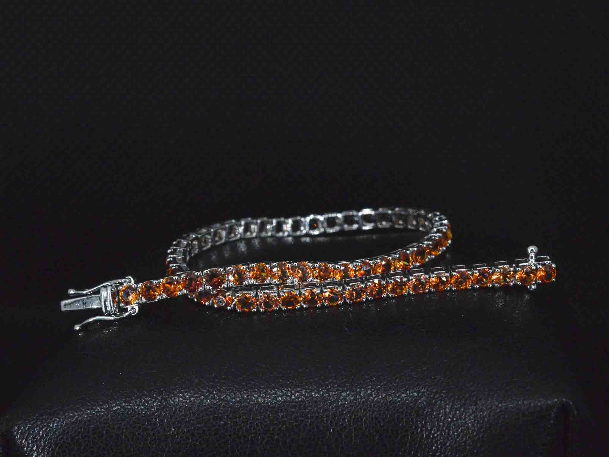 Gouden tennisarmband met 8.00 carat aan oranje saffieren