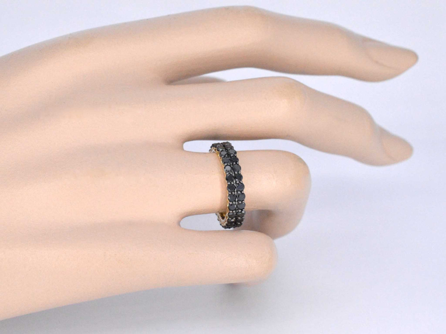 Gouden dubbele eternity ring met zwarte diamanten