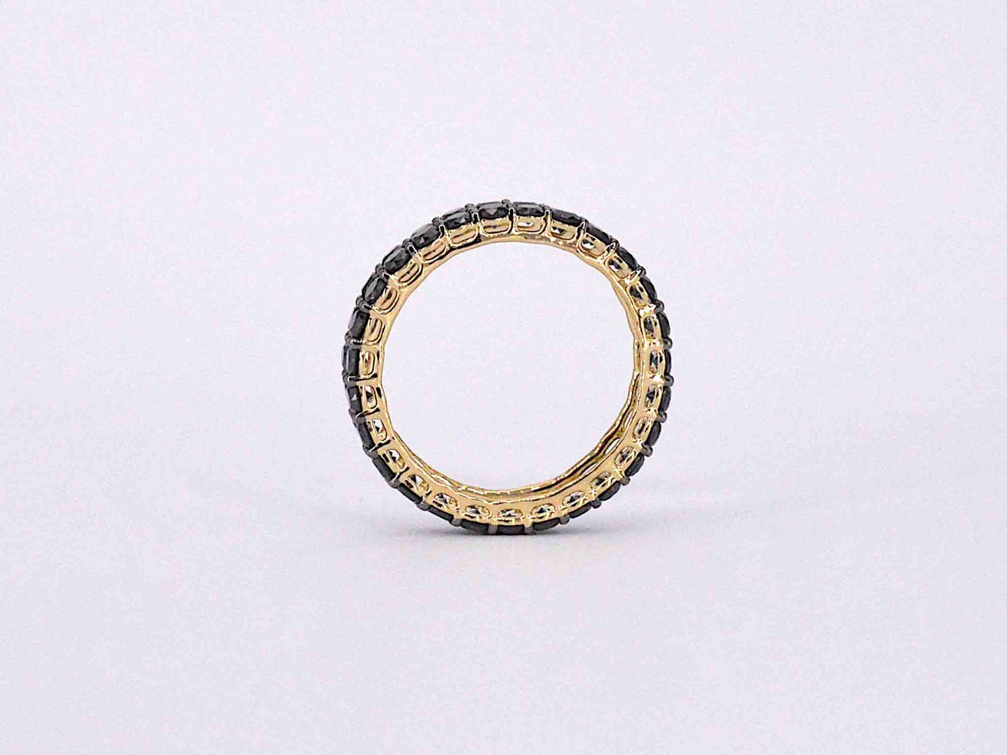 Gouden dubbele eternity ring met zwarte diamanten