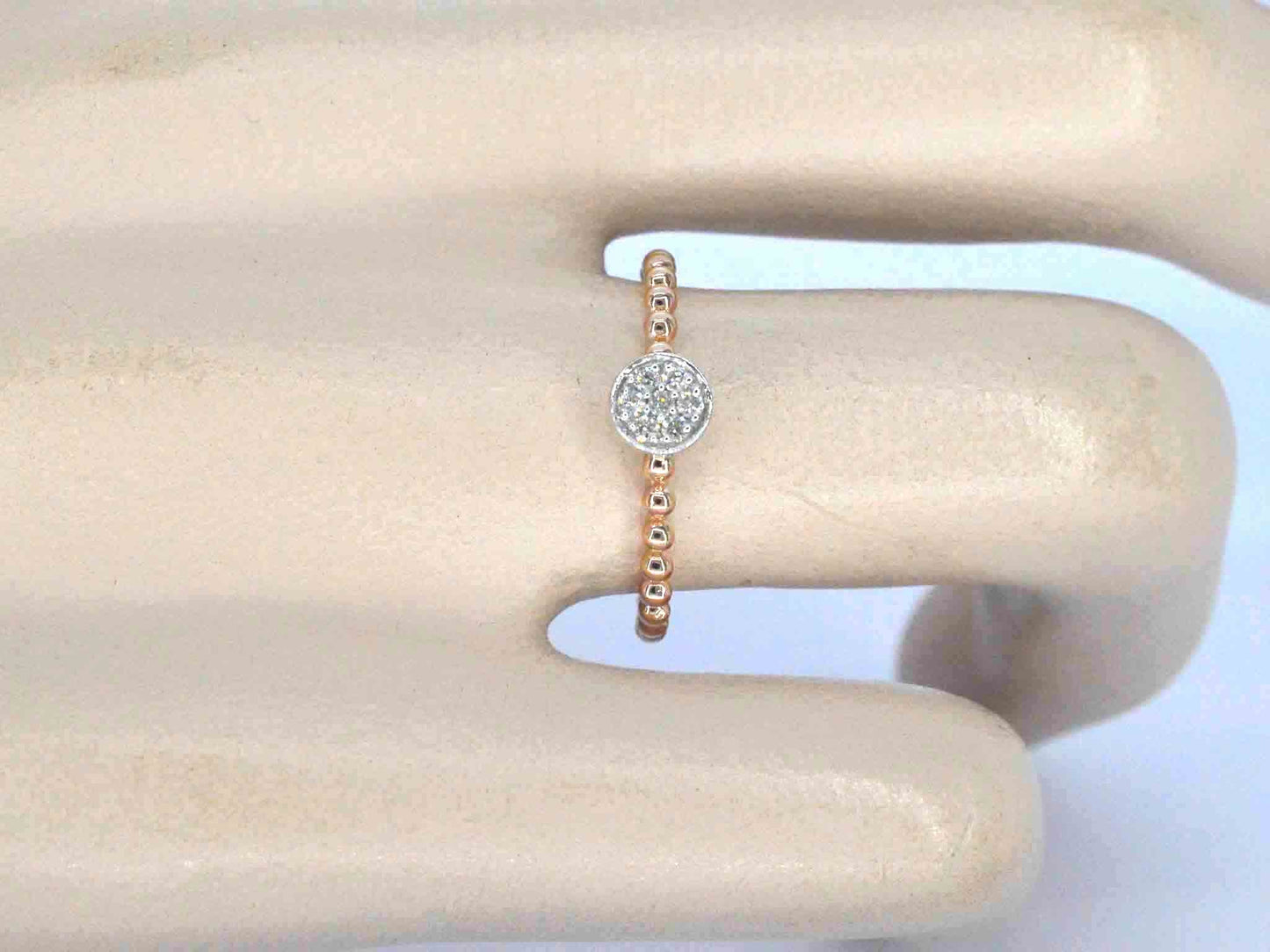 Rosegouden ring met centraal een rondje vol gezet met diamanten
