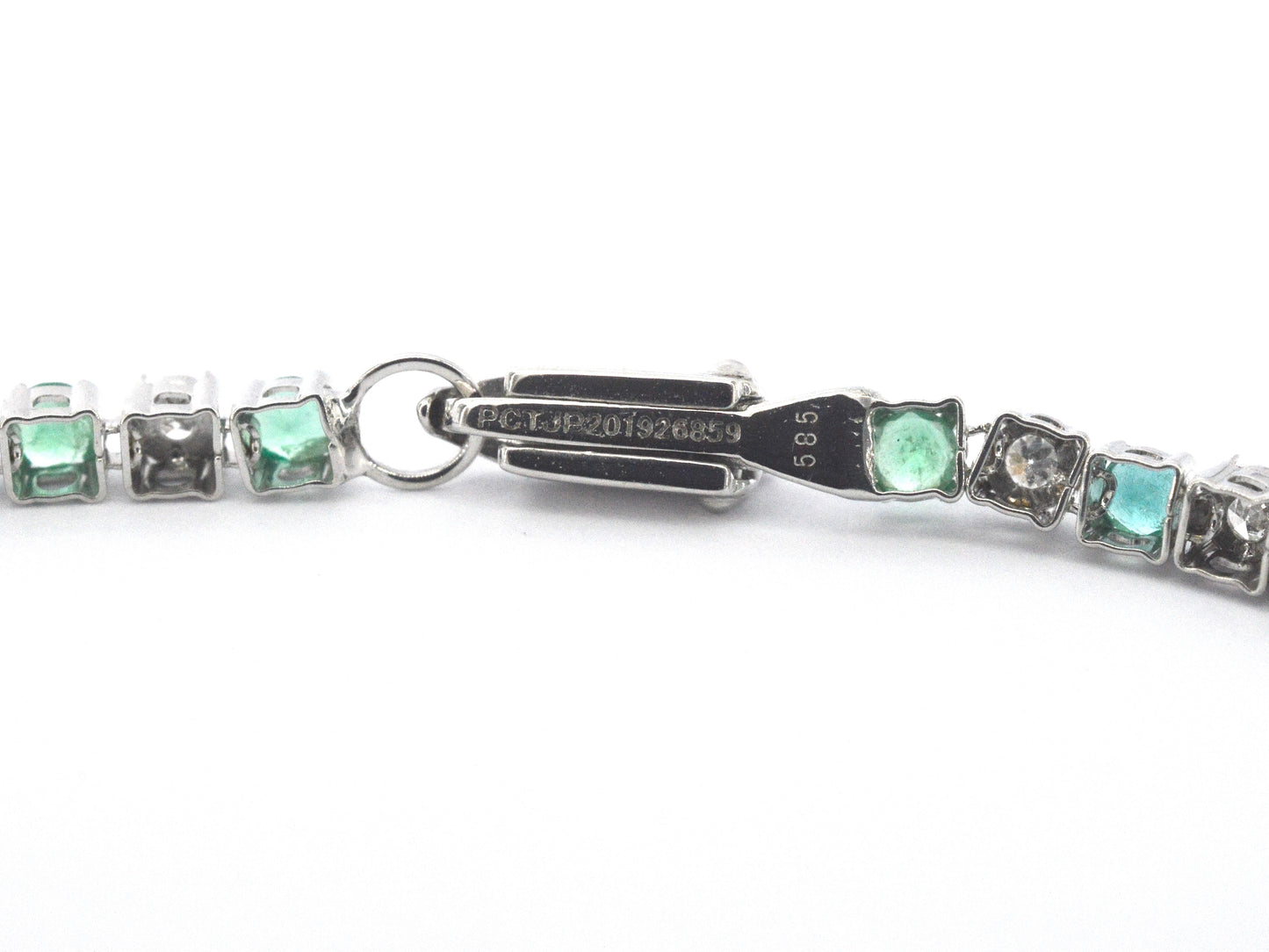 Witgouden tennisarmband met diamanten en smaragden