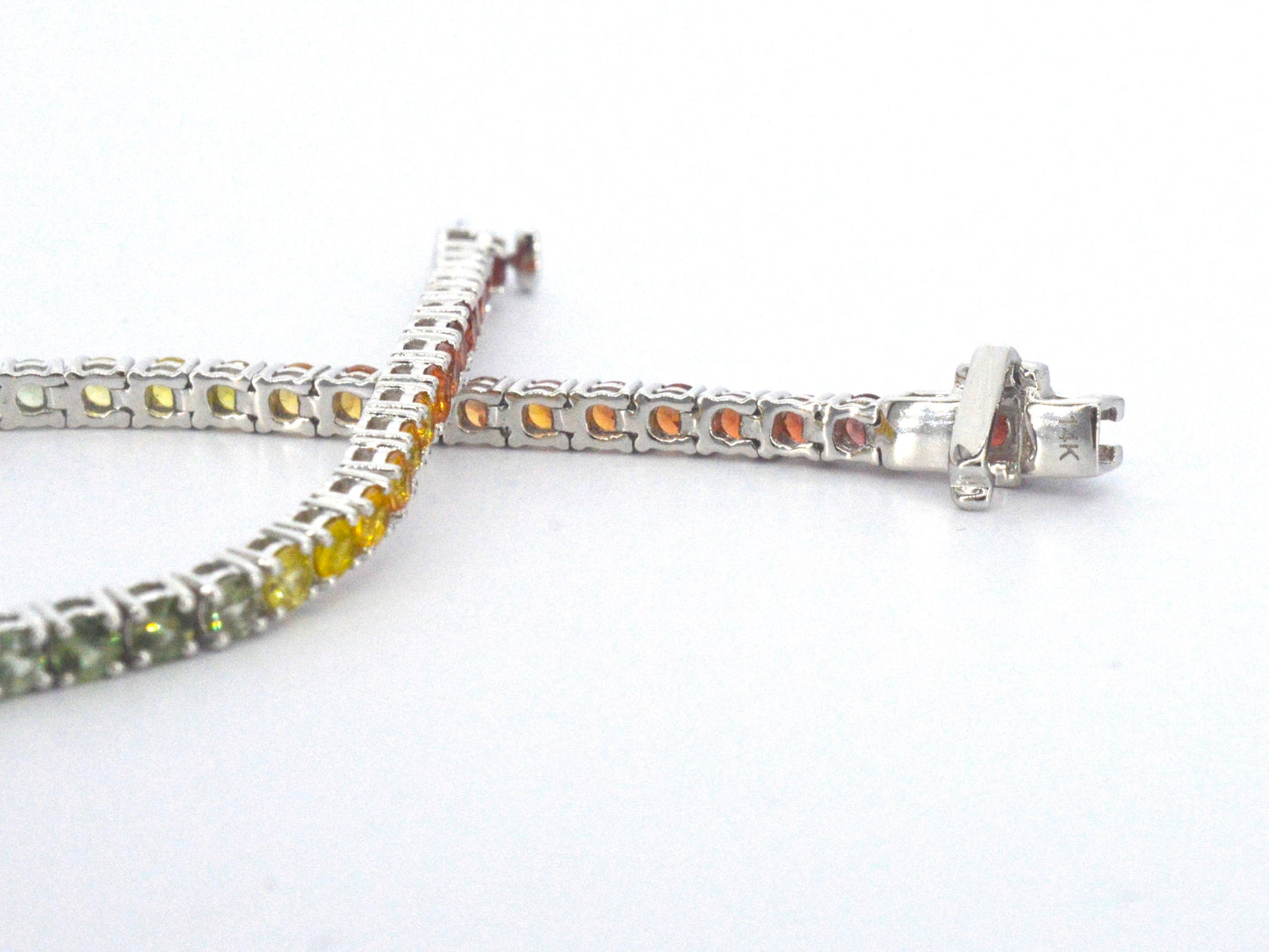 Gouden tennisarmband met multicolour saffieren