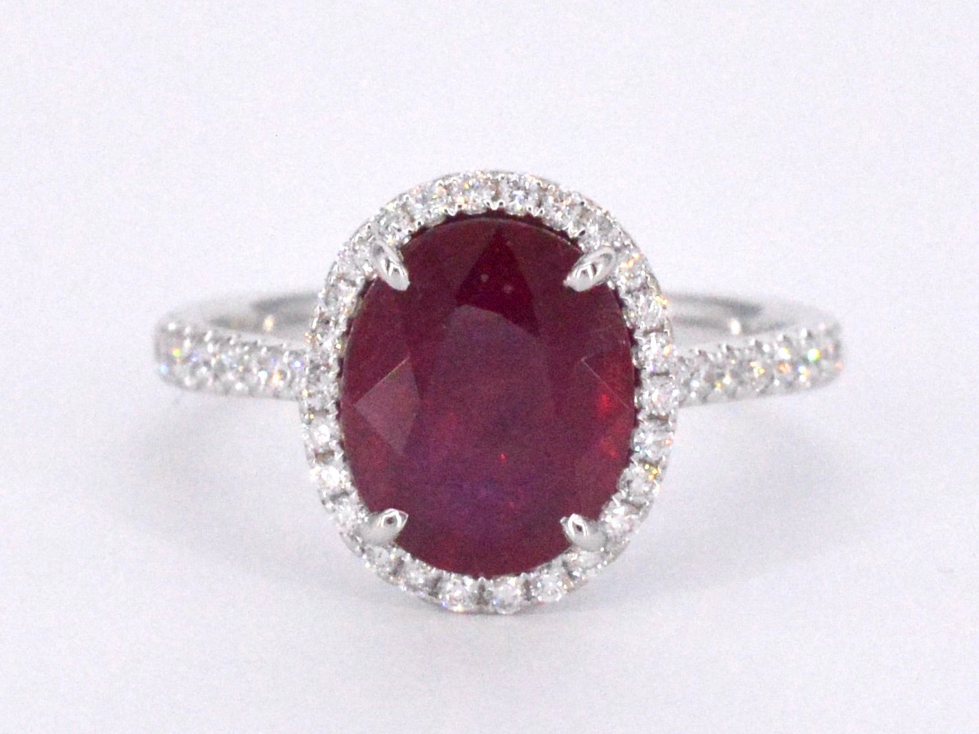 White gold entourage ring with diamonds and ruby