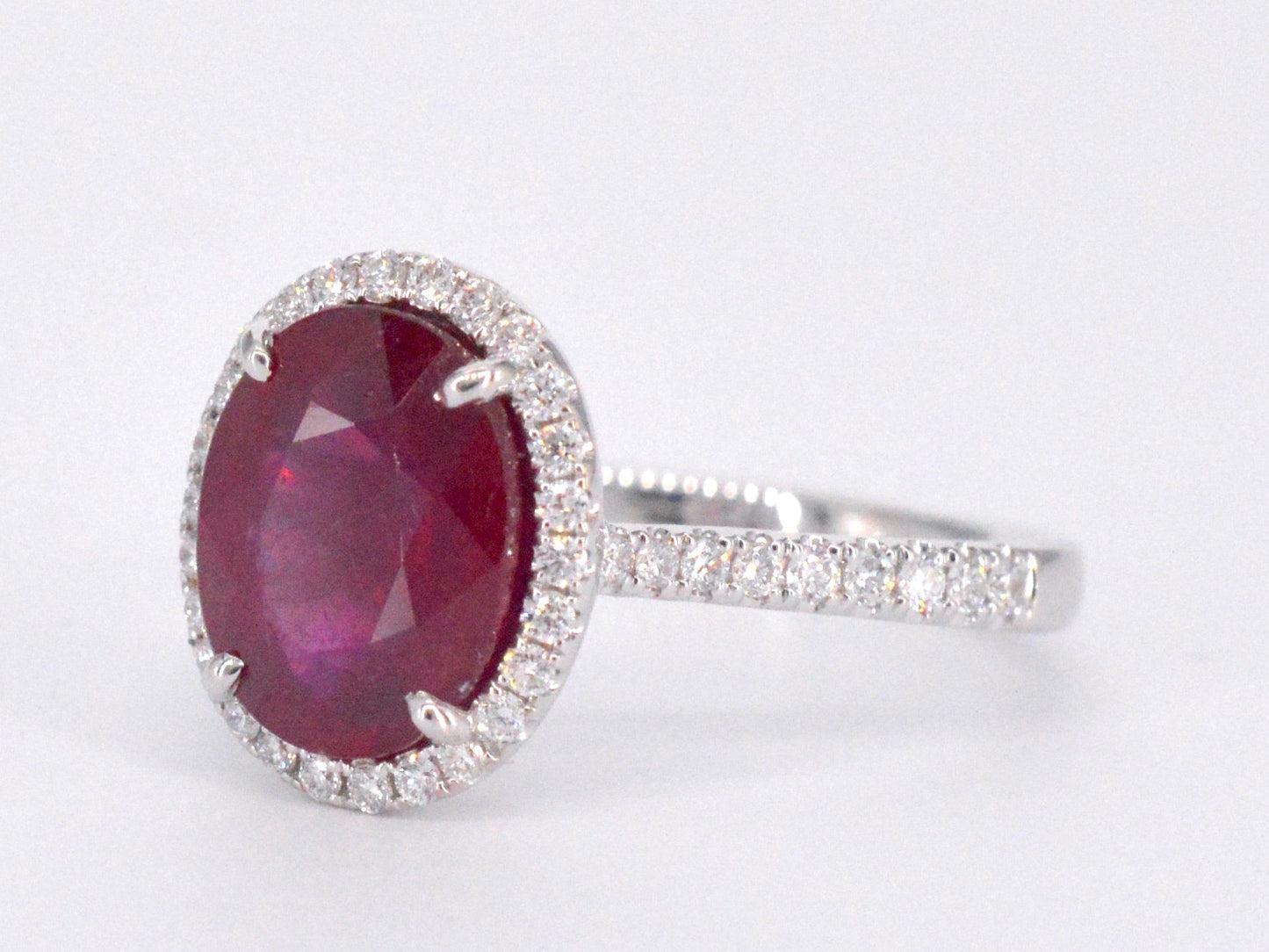 White gold entourage ring with diamonds and ruby
