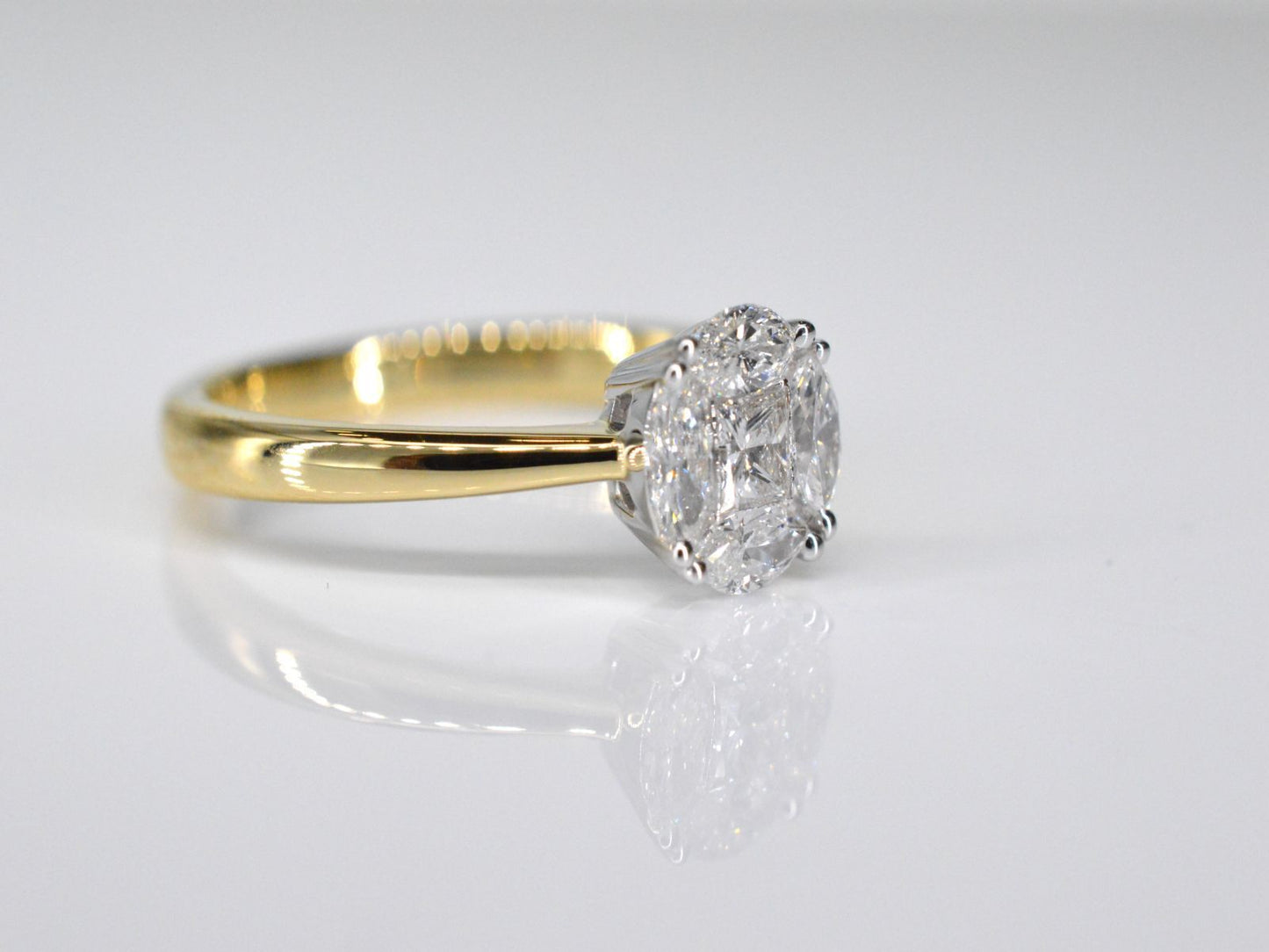 Gold ring with princess and marquise cut natural diamonds