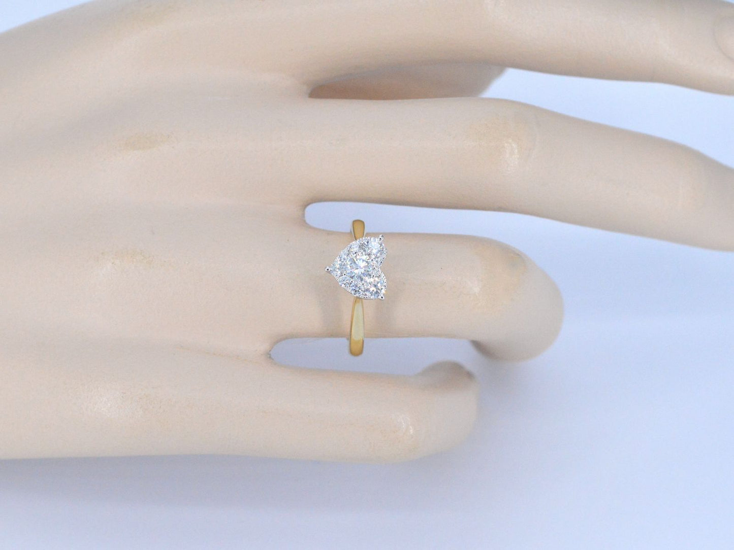 Gold ring with diamonds in heart shape