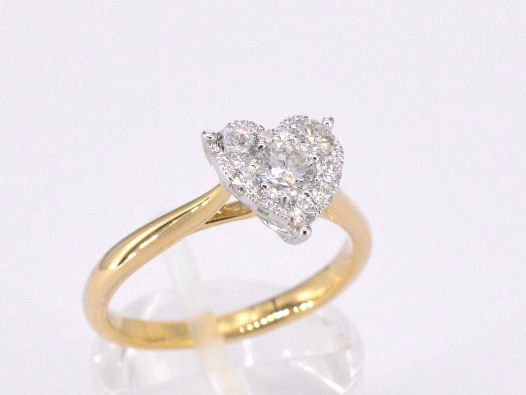 Gold ring with diamonds in heart shape