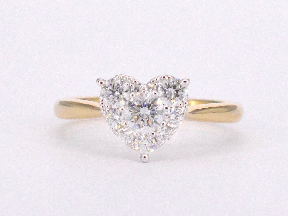 Gold ring with diamonds in heart shape