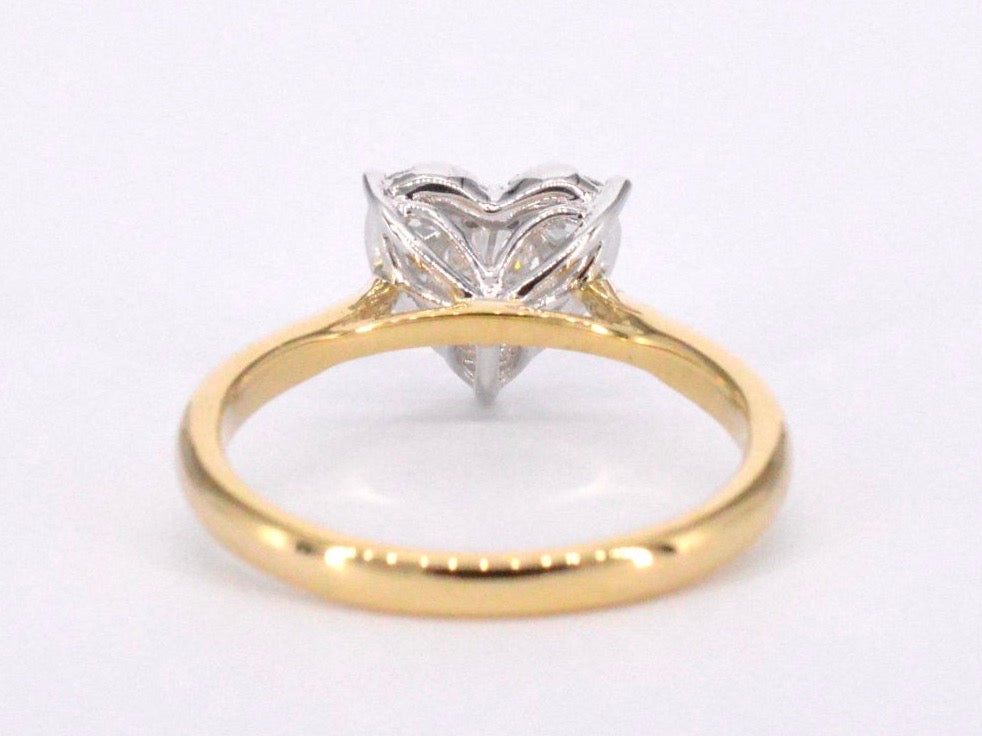 Gold ring with diamonds in heart shape