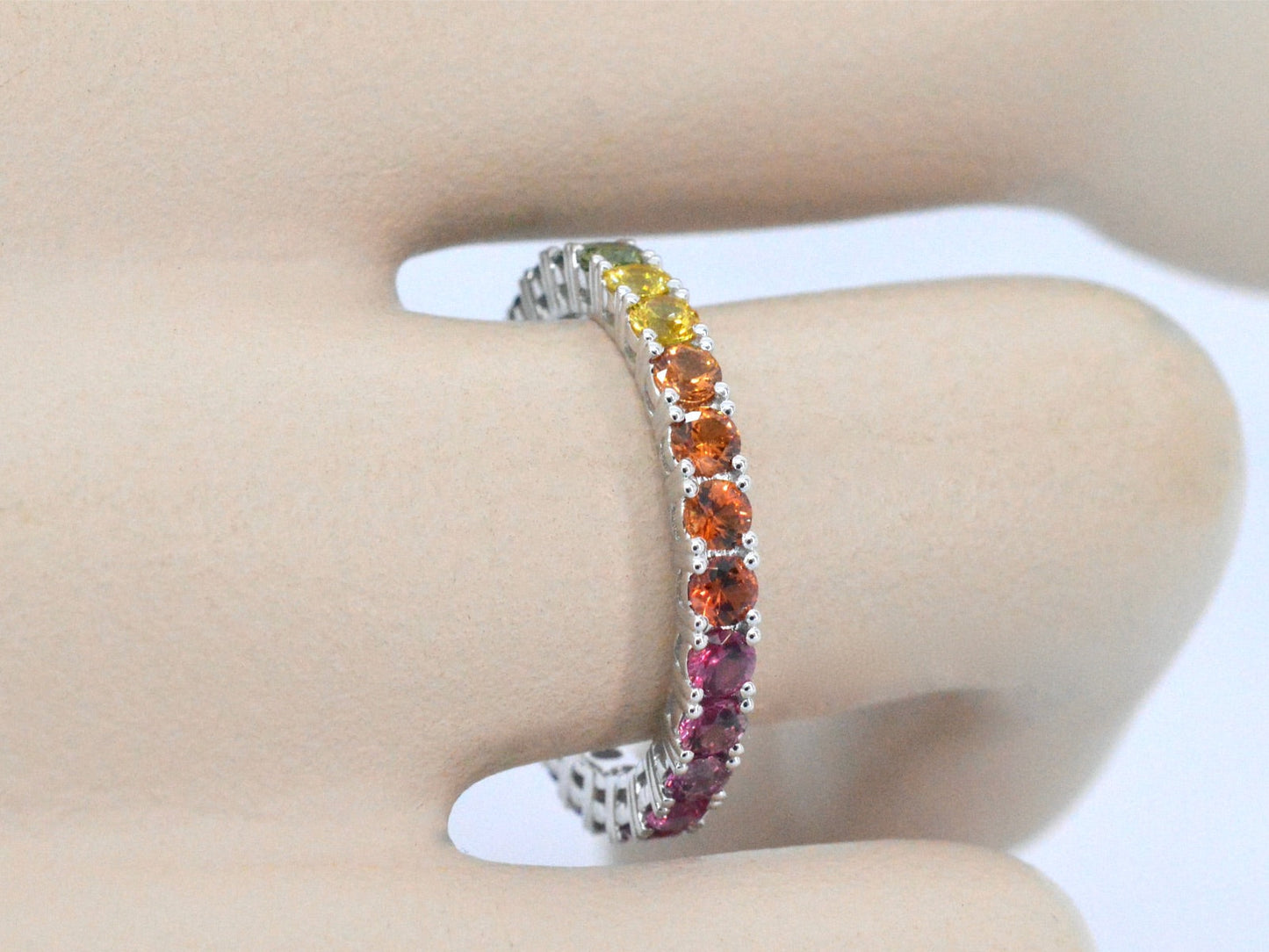 White gold ring with multicoloured sapphires