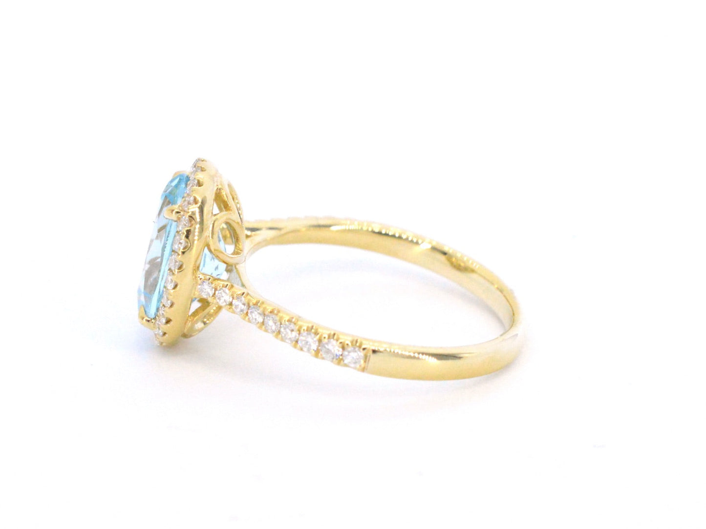 Gold entourage ring with oval cut topaz