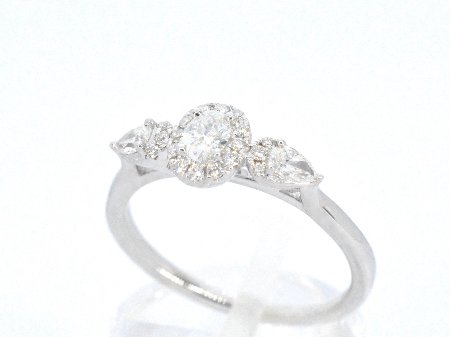 White gold ring with diamonds and an oval cut diamond