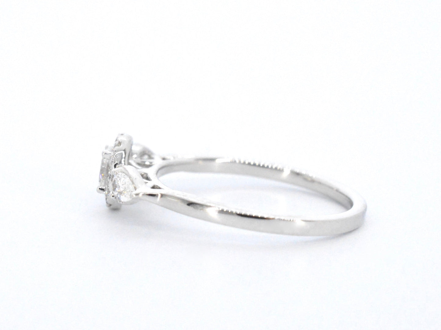 White gold ring with diamonds and an oval cut diamond