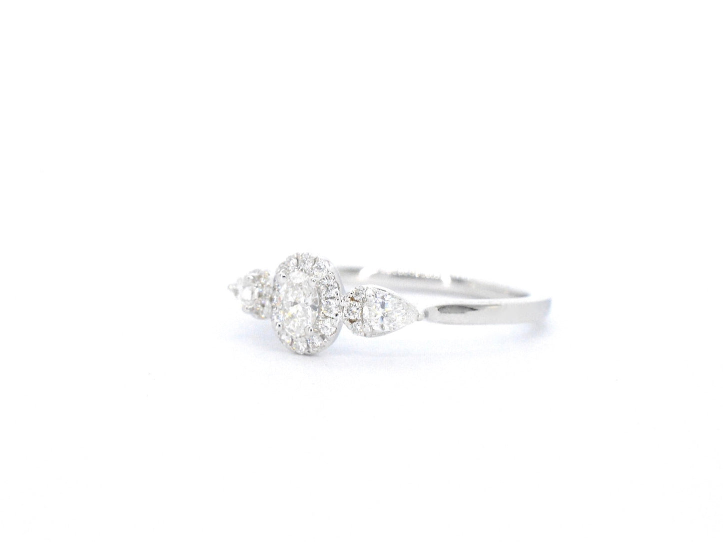White gold ring with diamonds and an oval cut diamond