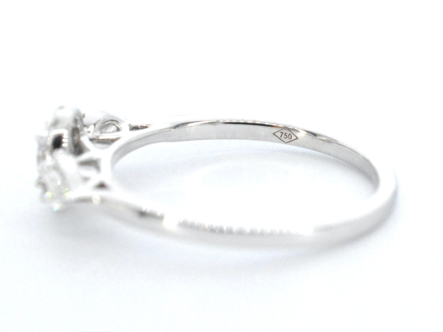 White gold ring with diamonds and an oval cut diamond