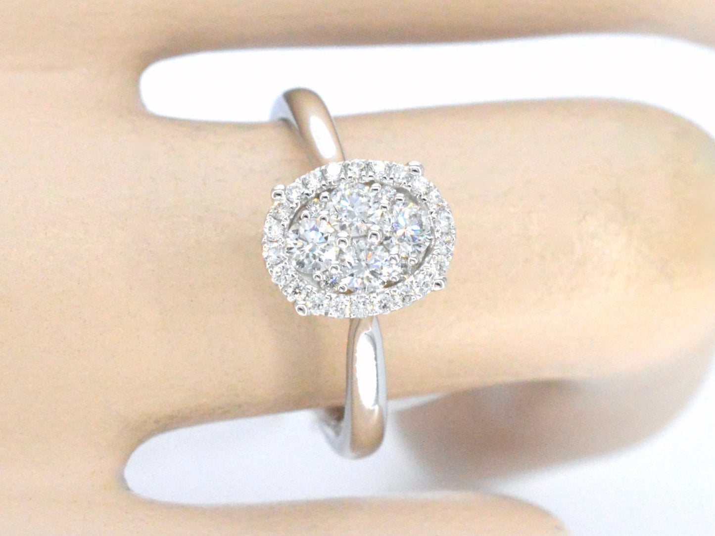 White gold ring with diamonds in oval shape