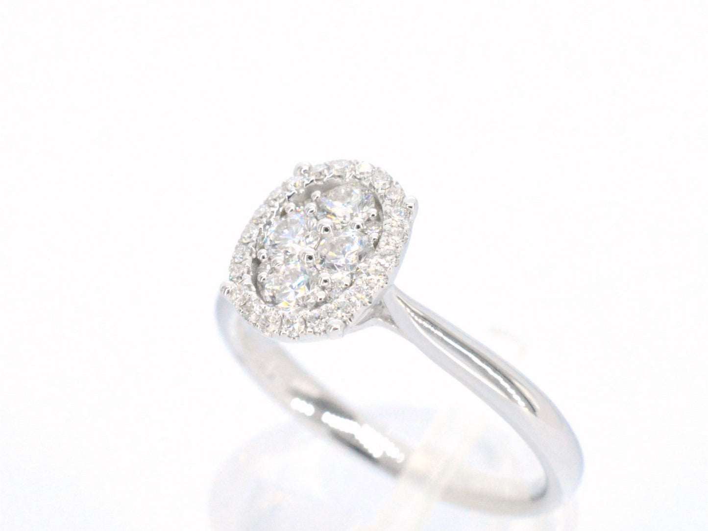 White gold ring with diamonds in oval shape