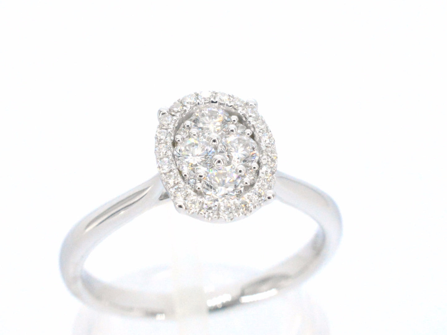 White gold ring with diamonds in oval shape