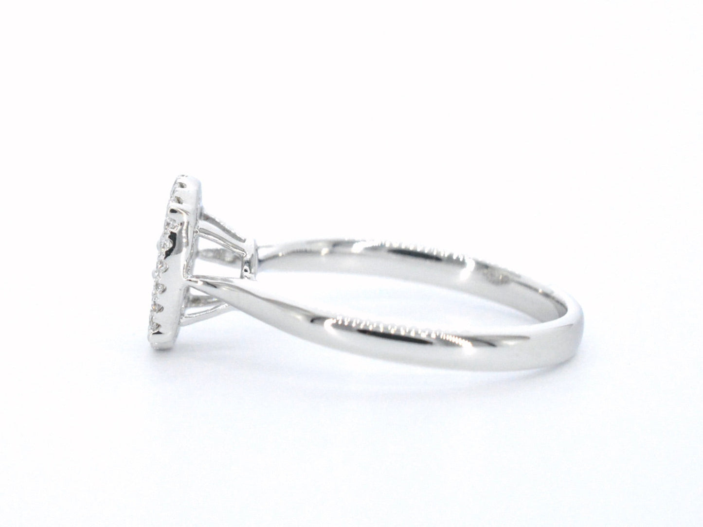 White gold ring with diamonds in oval shape