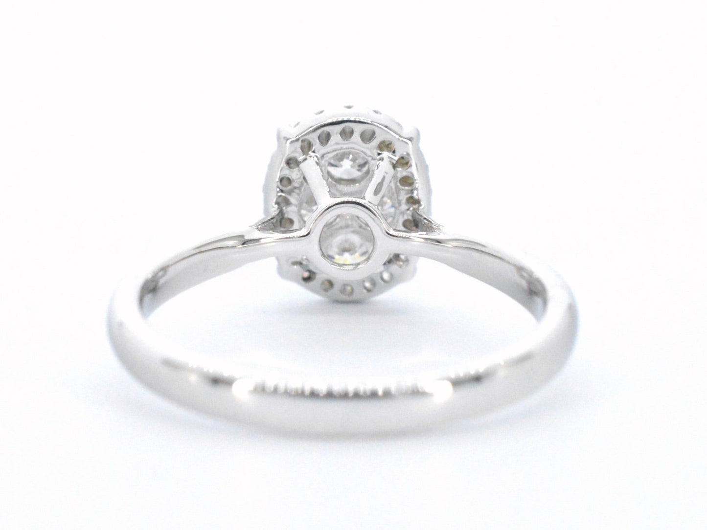 White gold ring with diamonds in oval shape