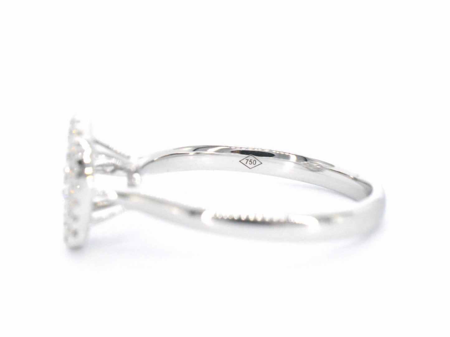White gold ring with diamonds in oval shape