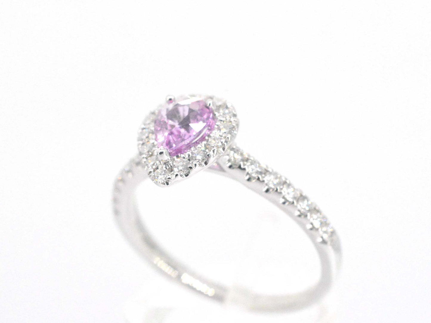 White gold entourage ring with a pink sapphire