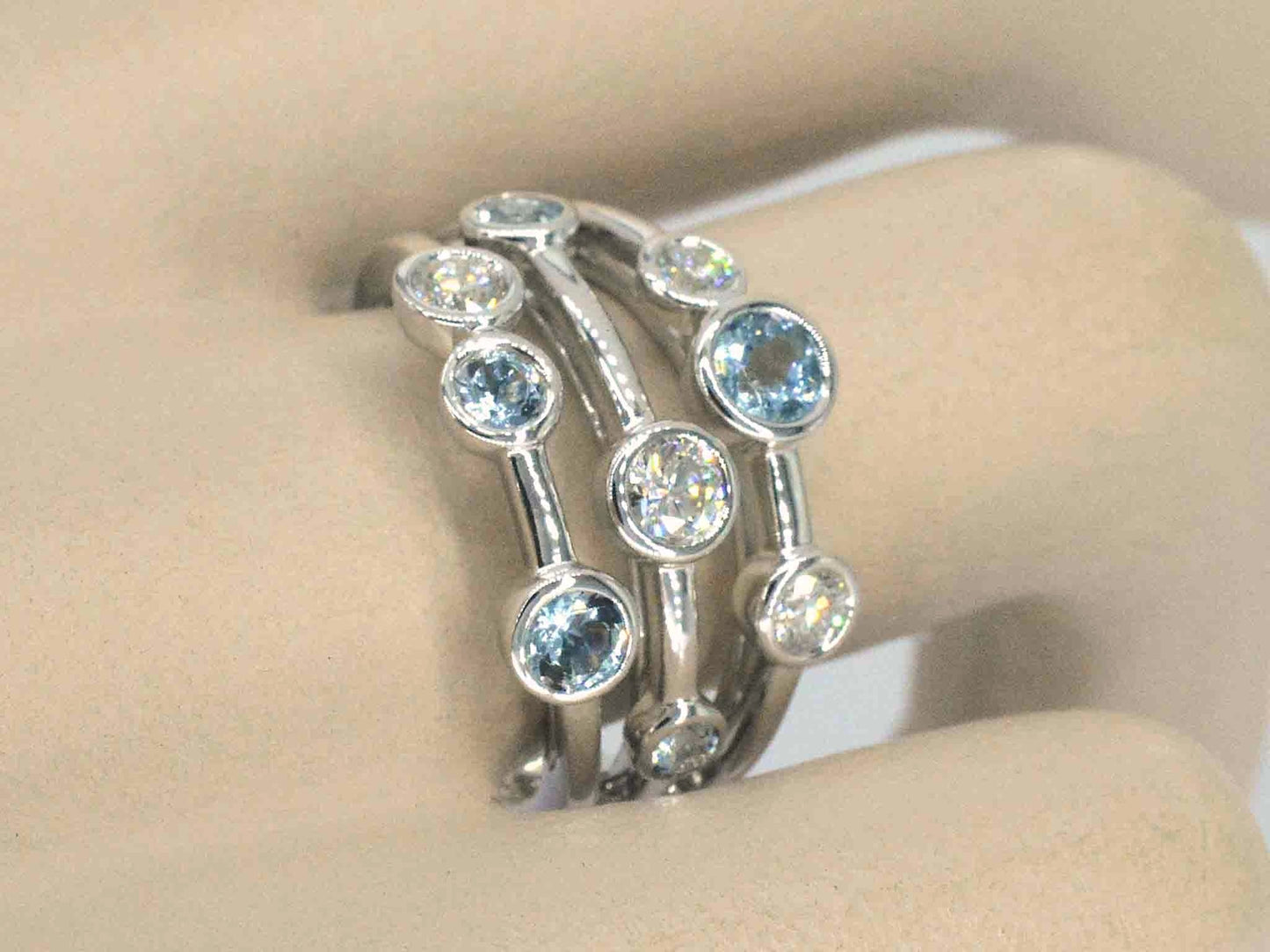 White gold design ring with aquamarine and diamond