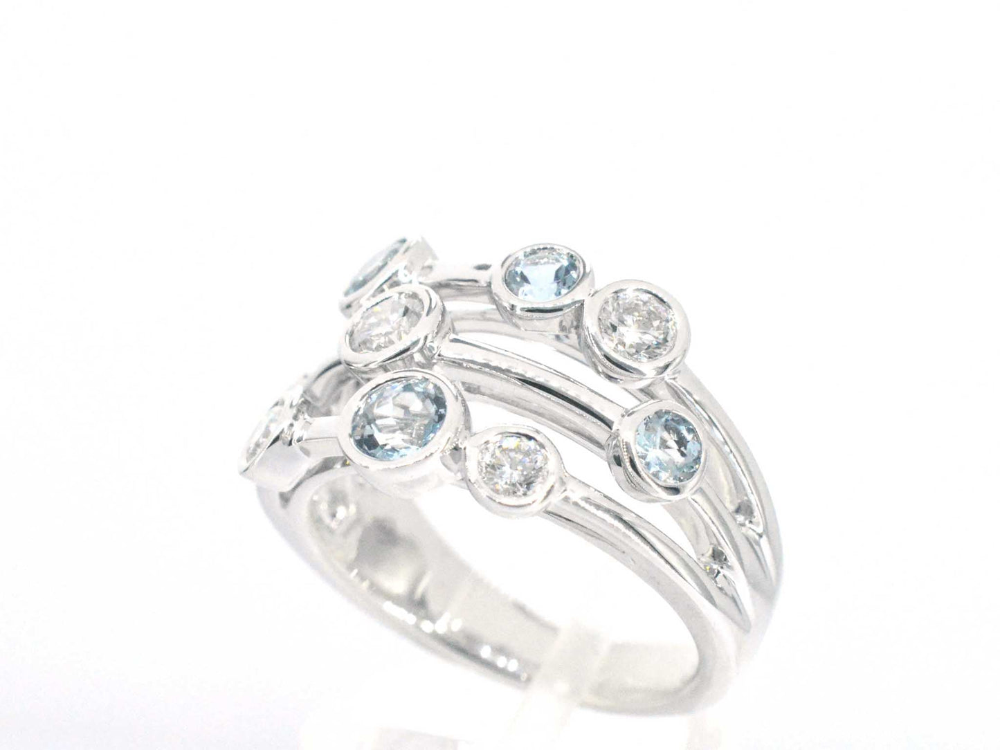 White gold design ring with aquamarine and diamond