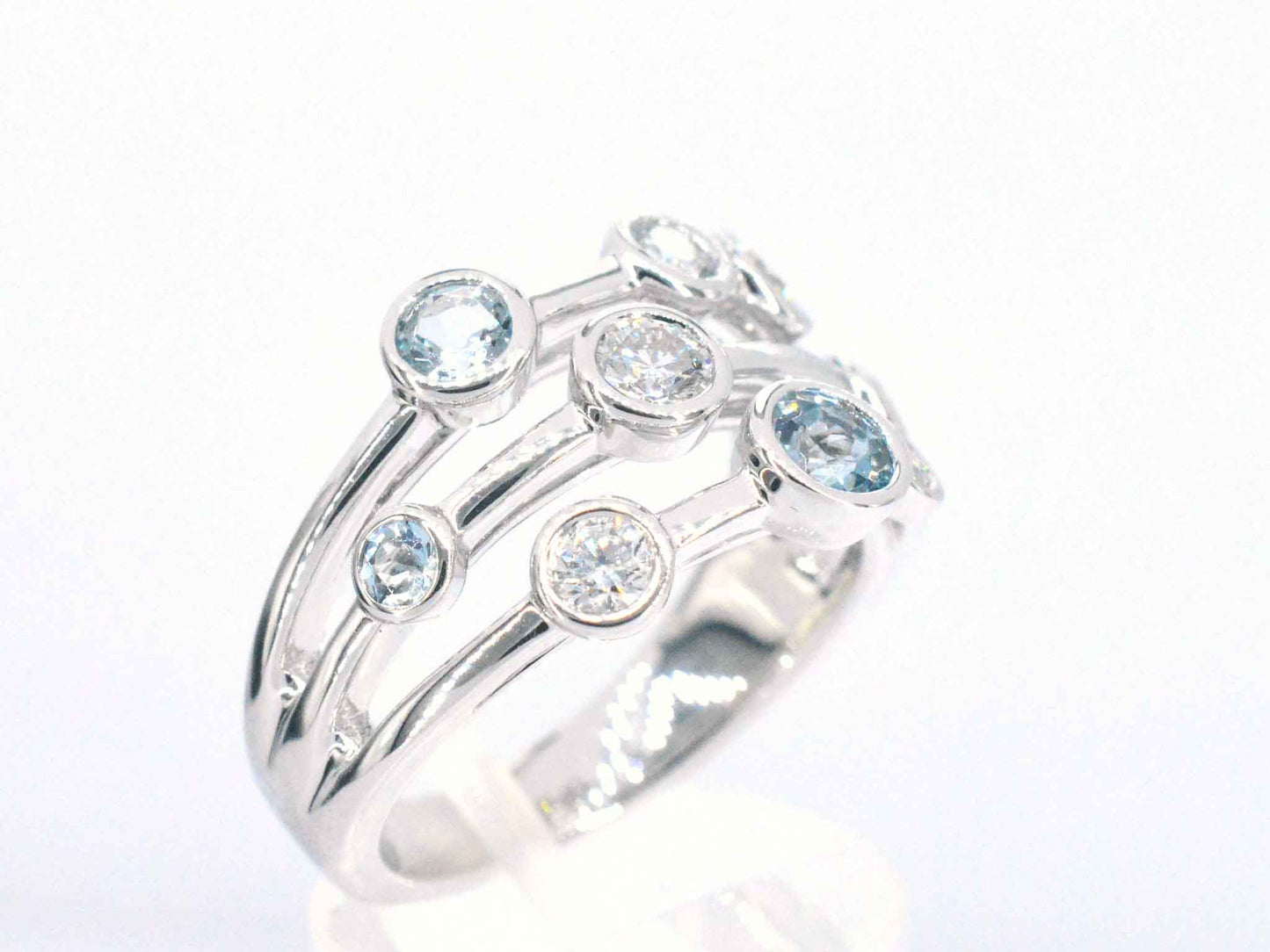 White gold design ring with aquamarine and diamond