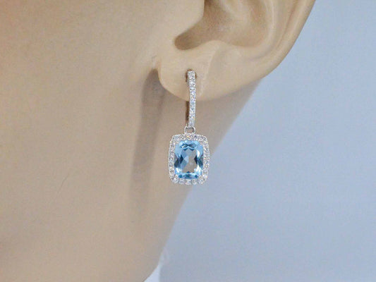 Witgouden entourage oorbellen met grote topazen en diamanten