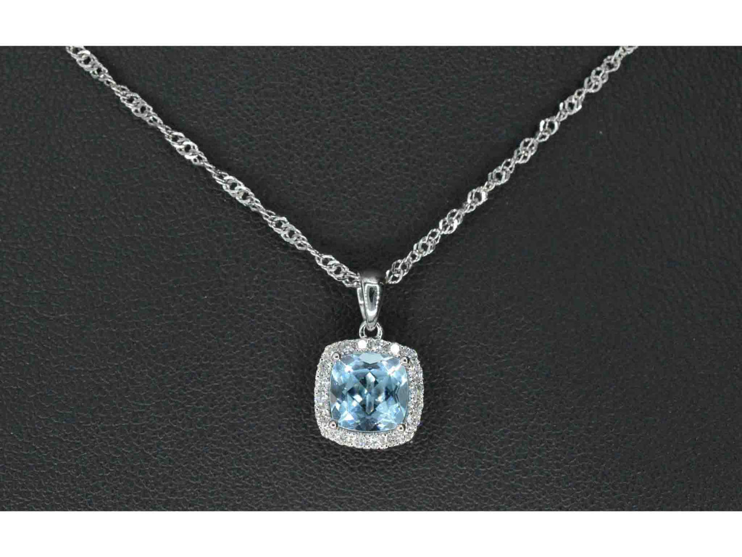 White gold entourage pendant set with topaz and diamonds