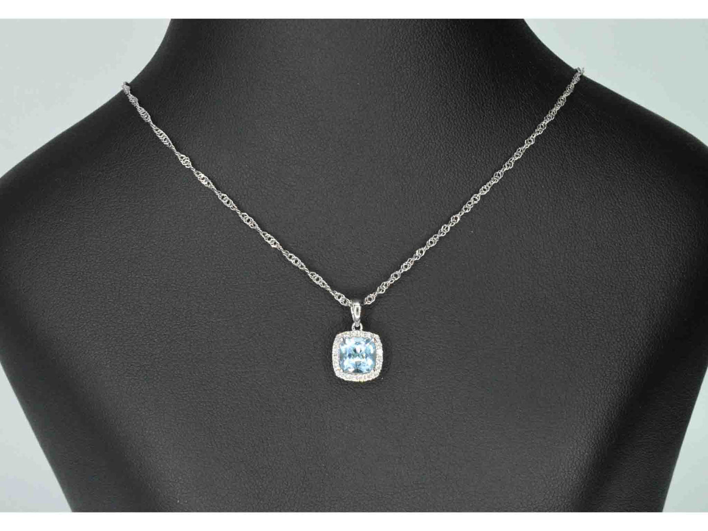 White gold entourage pendant set with topaz and diamonds